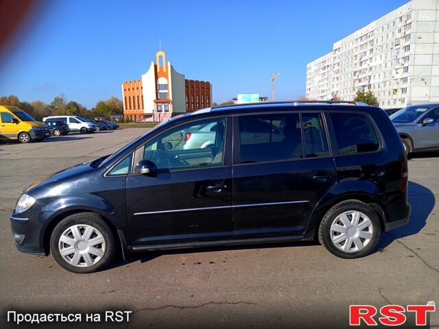 Черный Фольксваген Туран, объемом двигателя 1.4 л и пробегом 291 тыс. км за 6050 $, фото 1 на Automoto.ua