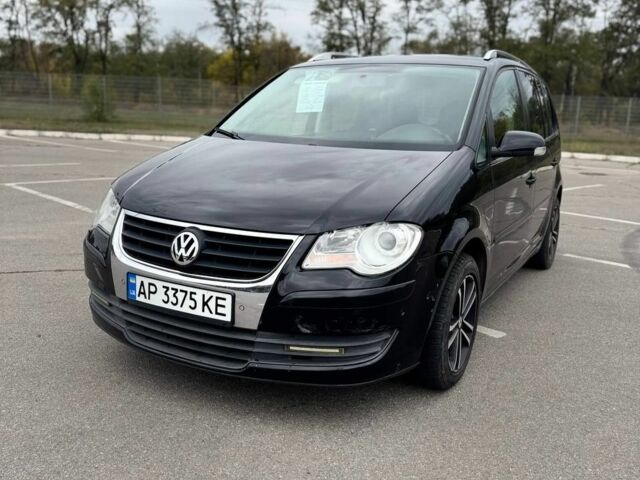 Черный Фольксваген Туран, объемом двигателя 1.4 л и пробегом 211 тыс. км за 7100 $, фото 2 на Automoto.ua