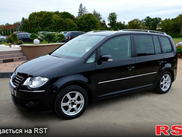 Черный Фольксваген Туран, объемом двигателя 2 л и пробегом 268 тыс. км за 2400 $, фото 1 на Automoto.ua