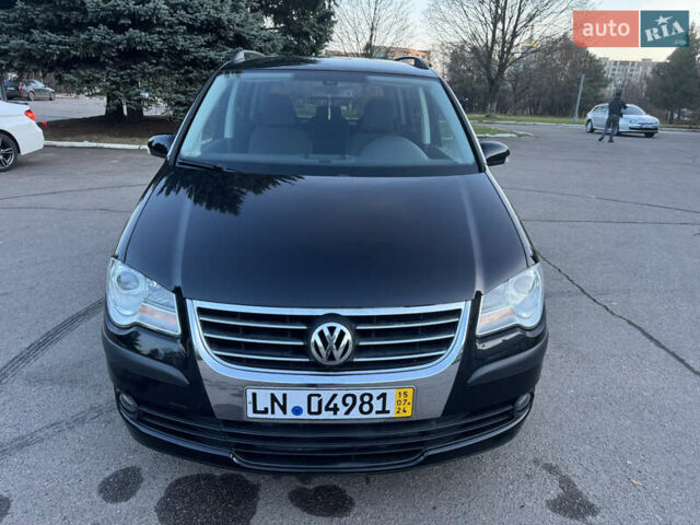 Черный Фольксваген Туран, объемом двигателя 1.4 л и пробегом 224 тыс. км за 6499 $, фото 1 на Automoto.ua