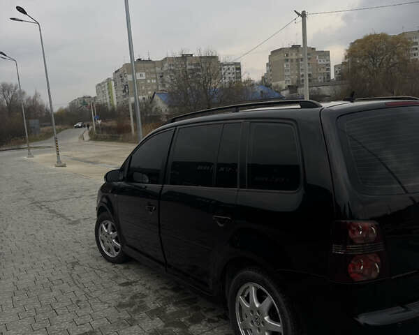 Черный Фольксваген Туран, объемом двигателя 1.4 л и пробегом 247 тыс. км за 7500 $, фото 5 на Automoto.ua