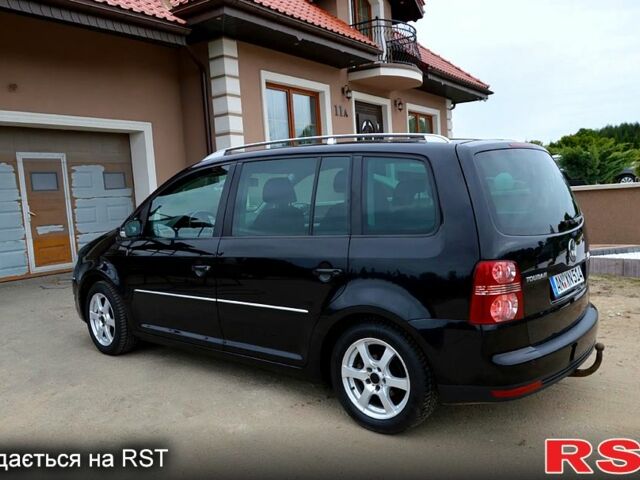 Черный Фольксваген Туран, объемом двигателя 2 л и пробегом 268 тыс. км за 2400 $, фото 2 на Automoto.ua