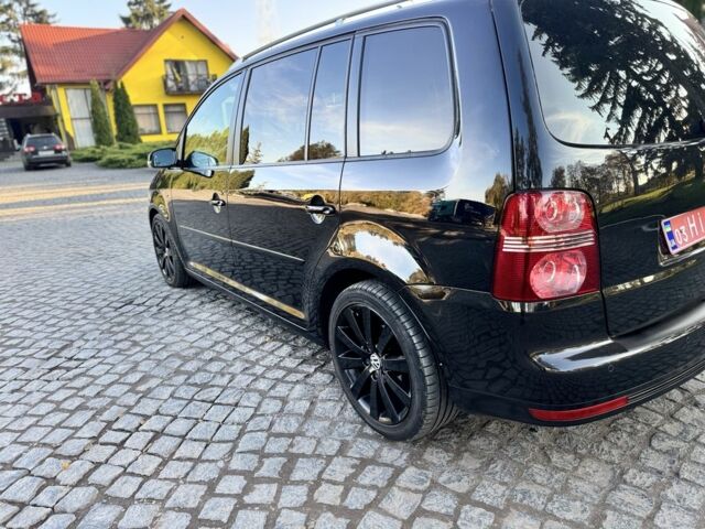 Черный Фольксваген Туран, объемом двигателя 1.4 л и пробегом 200 тыс. км за 7300 $, фото 2 на Automoto.ua