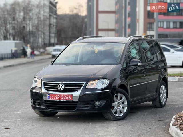 Черный Фольксваген Туран, объемом двигателя 1.4 л и пробегом 210 тыс. км за 5499 $, фото 2 на Automoto.ua
