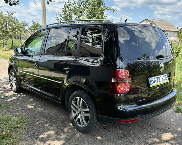 Черный Фольксваген Туран, объемом двигателя 1.39 л и пробегом 191 тыс. км за 8500 $, фото 18 на Automoto.ua