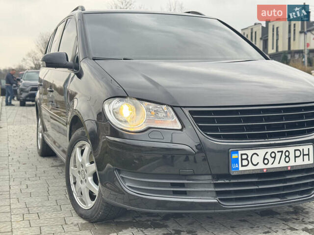 Черный Фольксваген Туран, объемом двигателя 1.4 л и пробегом 247 тыс. км за 7500 $, фото 1 на Automoto.ua