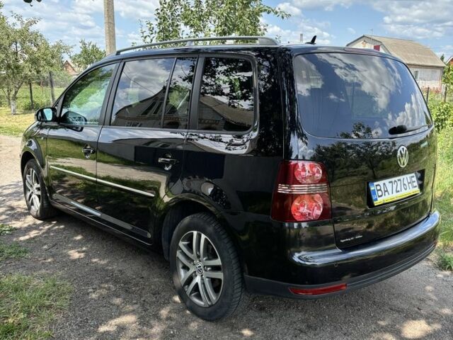 Черный Фольксваген Туран, объемом двигателя 1.4 л и пробегом 191 тыс. км за 8500 $, фото 2 на Automoto.ua