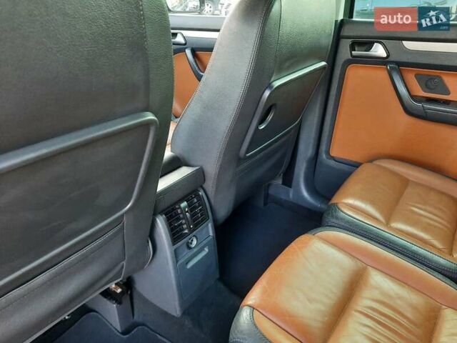 Черный Фольксваген Туран, объемом двигателя 1.6 л и пробегом 213 тыс. км за 8550 $, фото 84 на Automoto.ua