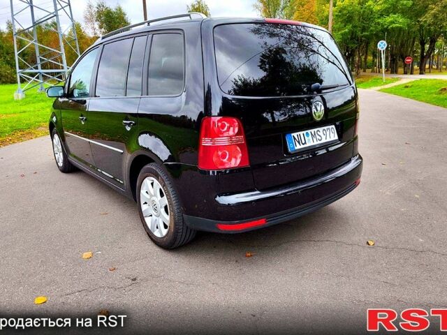 Черный Фольксваген Туран, объемом двигателя 2 л и пробегом 318 тыс. км за 2400 $, фото 2 на Automoto.ua