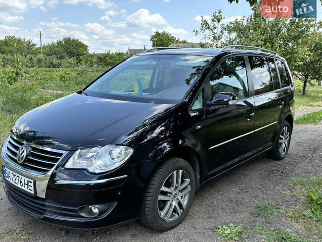 Черный Фольксваген Туран, объемом двигателя 1.39 л и пробегом 191 тыс. км за 8500 $, фото 1 на Automoto.ua