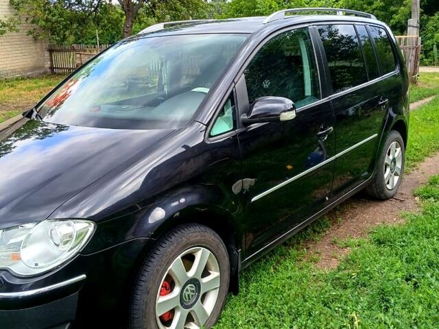 Черный Фольксваген Туран, объемом двигателя 1.4 л и пробегом 240 тыс. км за 6500 $, фото 2 на Automoto.ua