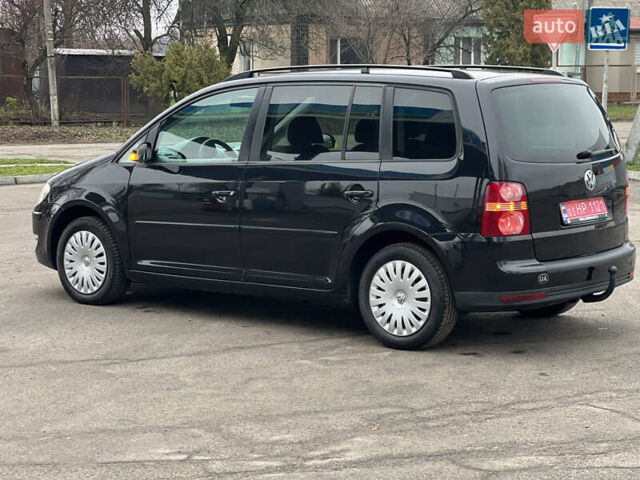 Черный Фольксваген Туран, объемом двигателя 1.6 л и пробегом 193 тыс. км за 7799 $, фото 21 на Automoto.ua