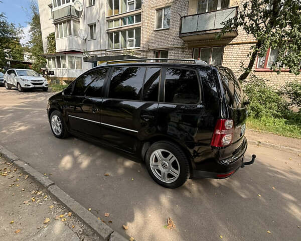 Черный Фольксваген Туран, объемом двигателя 1.39 л и пробегом 167 тыс. км за 7900 $, фото 2 на Automoto.ua