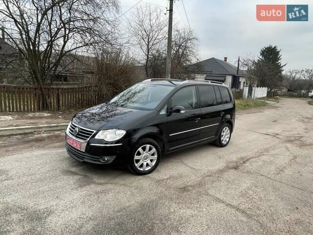 Черный Фольксваген Туран, объемом двигателя 1.4 л и пробегом 194 тыс. км за 6555 $, фото 184 на Automoto.ua