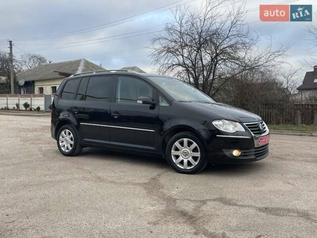 Черный Фольксваген Туран, объемом двигателя 1.4 л и пробегом 194 тыс. км за 6555 $, фото 175 на Automoto.ua