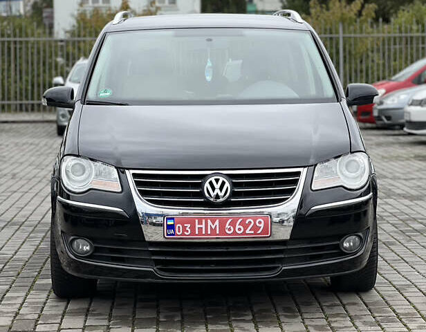 Черный Фольксваген Туран, объемом двигателя 1.4 л и пробегом 195 тыс. км за 7600 $, фото 1 на Automoto.ua