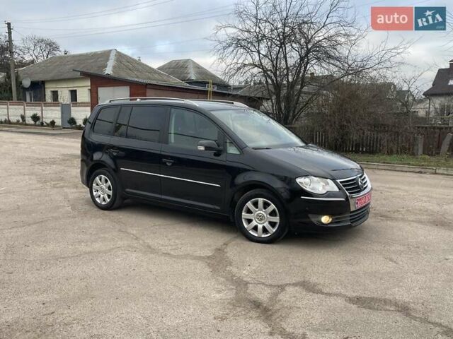 Черный Фольксваген Туран, объемом двигателя 1.4 л и пробегом 194 тыс. км за 6555 $, фото 174 на Automoto.ua