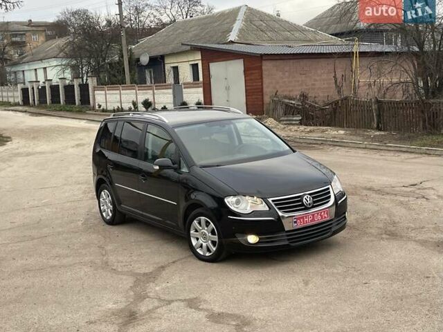 Черный Фольксваген Туран, объемом двигателя 1.4 л и пробегом 194 тыс. км за 6555 $, фото 1 на Automoto.ua