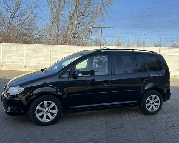 Черный Фольксваген Туран, объемом двигателя 1.9 л и пробегом 353 тыс. км за 6699 $, фото 4 на Automoto.ua