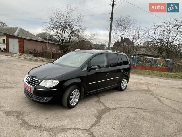 Черный Фольксваген Туран, объемом двигателя 1.4 л и пробегом 194 тыс. км за 6555 $, фото 73 на Automoto.ua