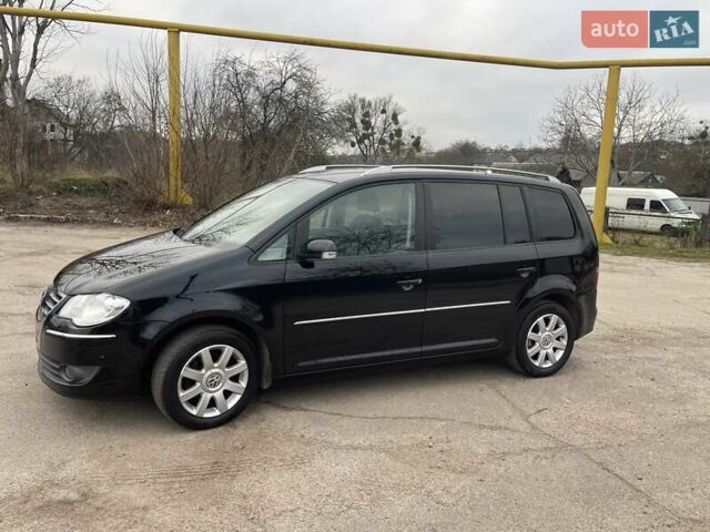 Черный Фольксваген Туран, объемом двигателя 1.4 л и пробегом 194 тыс. км за 6555 $, фото 103 на Automoto.ua