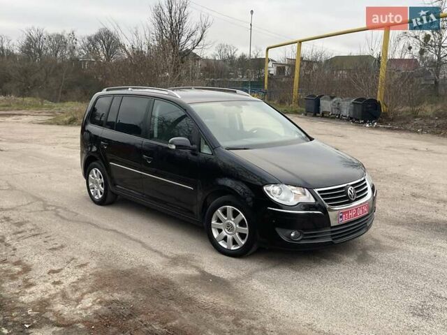 Черный Фольксваген Туран, объемом двигателя 1.4 л и пробегом 194 тыс. км за 6555 $, фото 188 на Automoto.ua