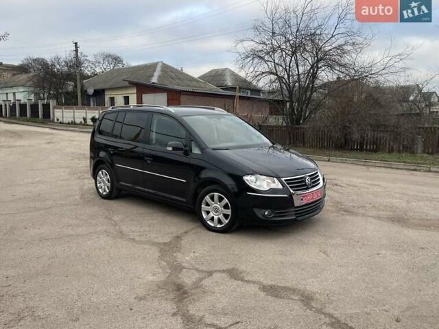 Черный Фольксваген Туран, объемом двигателя 1.4 л и пробегом 194 тыс. км за 6555 $, фото 180 на Automoto.ua