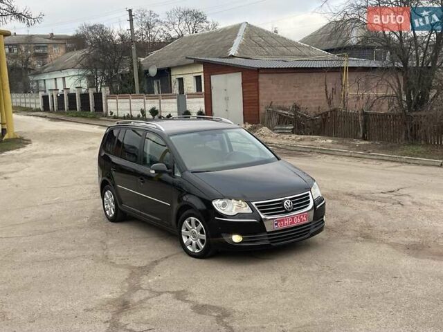 Черный Фольксваген Туран, объемом двигателя 1.4 л и пробегом 194 тыс. км за 6555 $, фото 169 на Automoto.ua