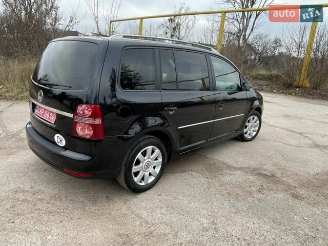 Черный Фольксваген Туран, объемом двигателя 1.4 л и пробегом 194 тыс. км за 6555 $, фото 95 на Automoto.ua