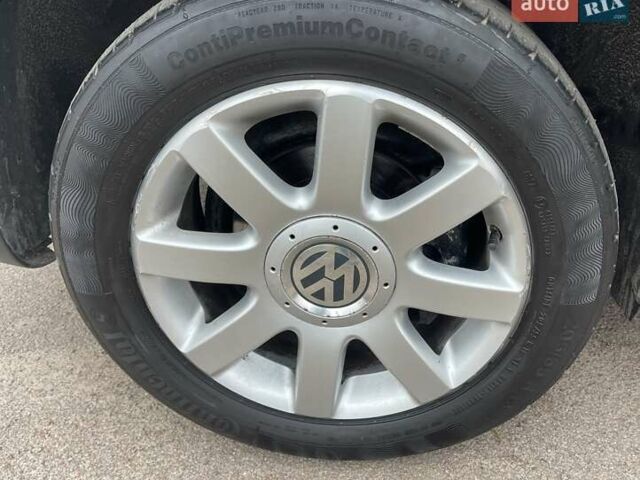 Черный Фольксваген Туран, объемом двигателя 1.4 л и пробегом 194 тыс. км за 6555 $, фото 6 на Automoto.ua