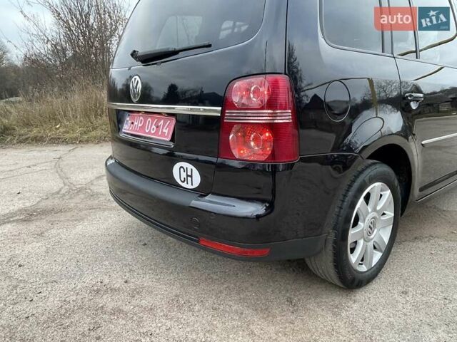 Черный Фольксваген Туран, объемом двигателя 1.4 л и пробегом 194 тыс. км за 6555 $, фото 93 на Automoto.ua
