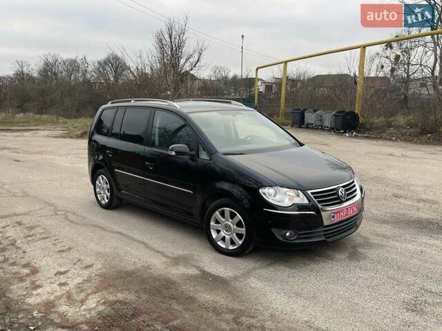 Черный Фольксваген Туран, объемом двигателя 1.4 л и пробегом 194 тыс. км за 6555 $, фото 187 на Automoto.ua