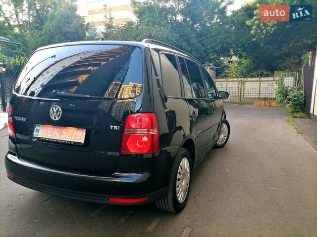 Черный Фольксваген Туран, объемом двигателя 1.4 л и пробегом 193 тыс. км за 6600 $, фото 2 на Automoto.ua