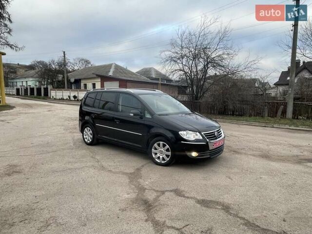 Черный Фольксваген Туран, объемом двигателя 1.4 л и пробегом 194 тыс. км за 6555 $, фото 176 на Automoto.ua