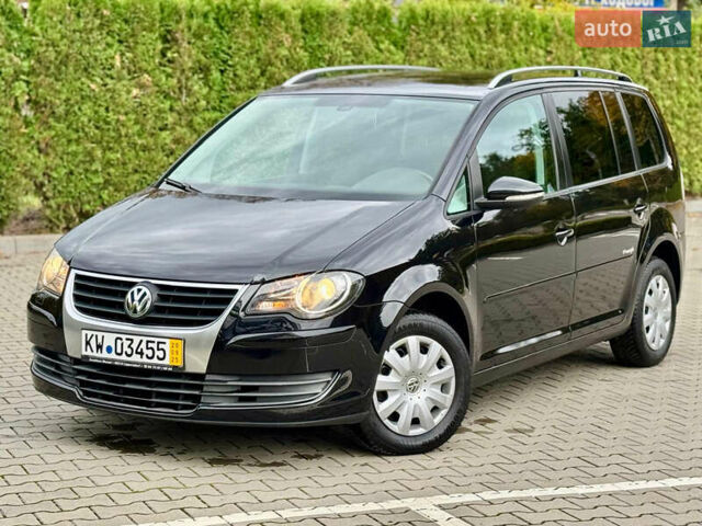 Черный Фольксваген Туран, объемом двигателя 1.4 л и пробегом 190 тыс. км за 7200 $, фото 1 на Automoto.ua