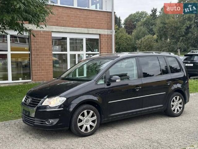 Черный Фольксваген Туран, объемом двигателя 1.4 л и пробегом 194 тыс. км за 6555 $, фото 224 на Automoto.ua