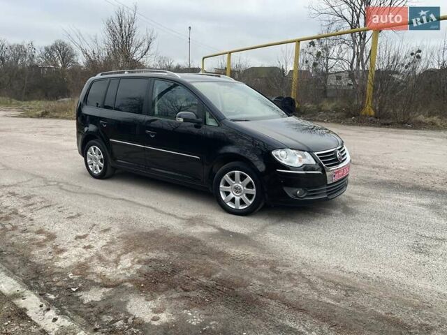 Черный Фольксваген Туран, объемом двигателя 1.4 л и пробегом 194 тыс. км за 6555 $, фото 189 на Automoto.ua