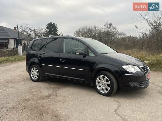 Черный Фольксваген Туран, объемом двигателя 1.4 л и пробегом 194 тыс. км за 6555 $, фото 98 на Automoto.ua