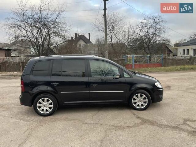 Черный Фольксваген Туран, объемом двигателя 1.4 л и пробегом 194 тыс. км за 6555 $, фото 181 на Automoto.ua