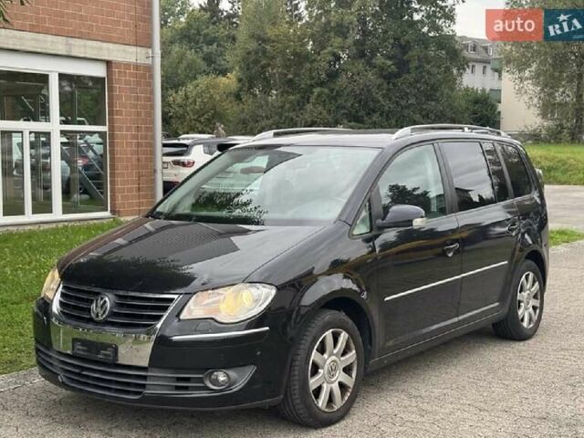 Черный Фольксваген Туран, объемом двигателя 1.4 л и пробегом 194 тыс. км за 6555 $, фото 225 на Automoto.ua