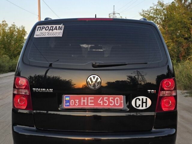 Черный Фольксваген Туран, объемом двигателя 1.4 л и пробегом 200 тыс. км за 6900 $, фото 2 на Automoto.ua