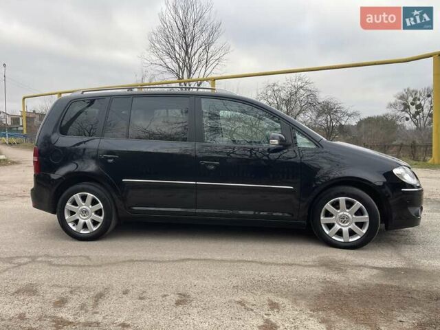 Черный Фольксваген Туран, объемом двигателя 1.4 л и пробегом 194 тыс. км за 6555 $, фото 191 на Automoto.ua