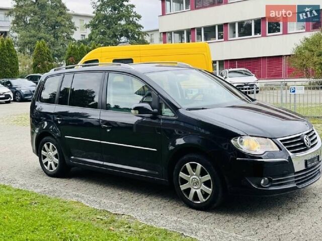 Черный Фольксваген Туран, объемом двигателя 1.4 л и пробегом 194 тыс. км за 6555 $, фото 226 на Automoto.ua