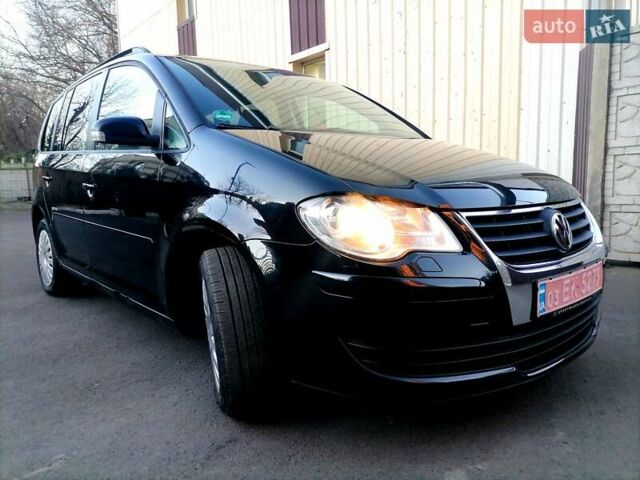 Черный Фольксваген Туран, объемом двигателя 1.4 л и пробегом 193 тыс. км за 6600 $, фото 18 на Automoto.ua