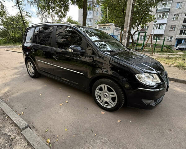 Черный Фольксваген Туран, объемом двигателя 1.39 л и пробегом 167 тыс. км за 7900 $, фото 7 на Automoto.ua