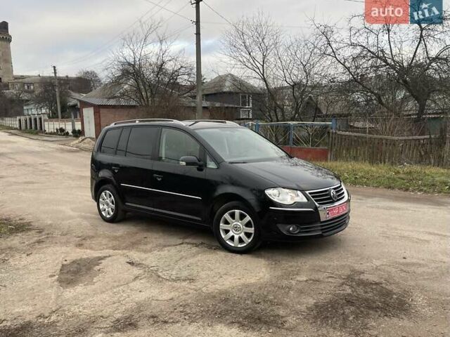 Черный Фольксваген Туран, объемом двигателя 1.4 л и пробегом 194 тыс. км за 6555 $, фото 2 на Automoto.ua