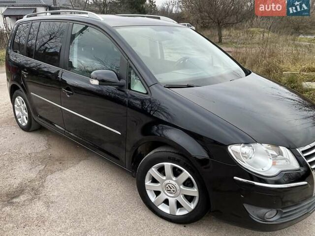 Черный Фольксваген Туран, объемом двигателя 1.4 л и пробегом 194 тыс. км за 6555 $, фото 86 на Automoto.ua