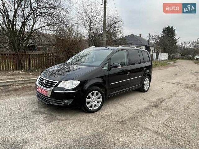 Черный Фольксваген Туран, объемом двигателя 1.4 л и пробегом 194 тыс. км за 6555 $, фото 183 на Automoto.ua