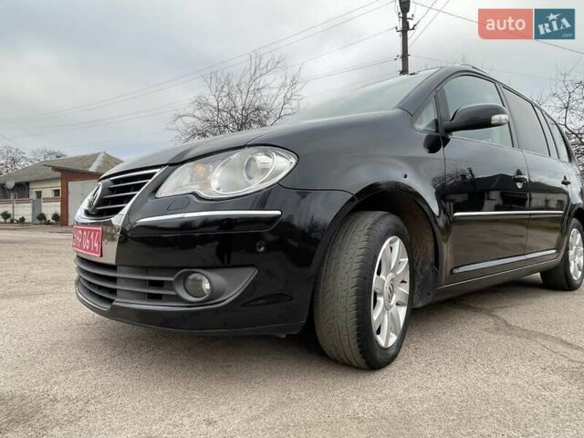 Черный Фольксваген Туран, объемом двигателя 1.4 л и пробегом 194 тыс. км за 6555 $, фото 76 на Automoto.ua