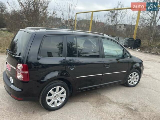 Черный Фольксваген Туран, объемом двигателя 1.4 л и пробегом 194 тыс. км за 6555 $, фото 97 на Automoto.ua